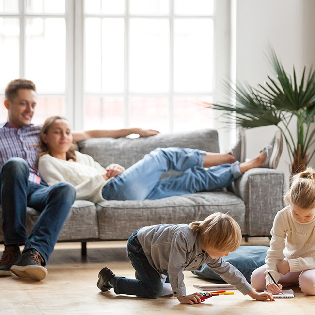 family-sitting-in-the-living-room-casper-wy